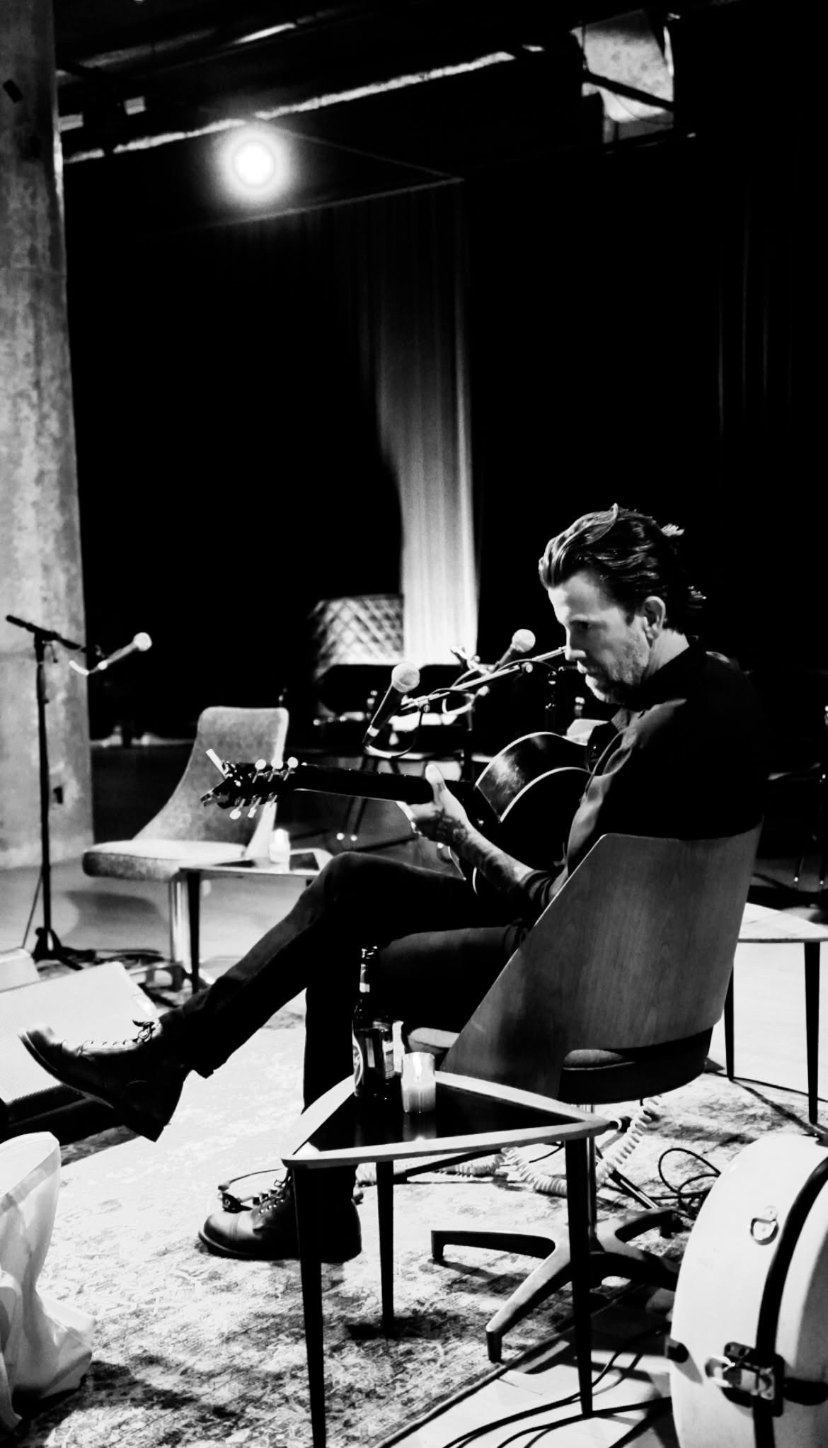 Jeremy Stanfill performing with an acoustic guitar